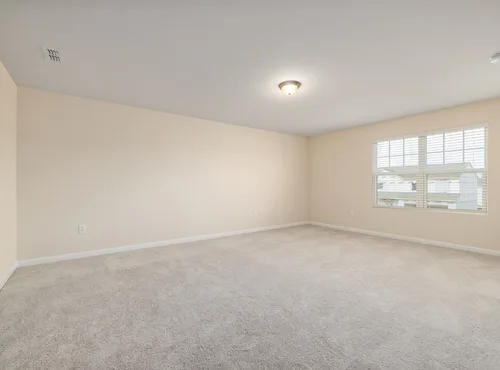 This is a photo of a cream carpet which has just been professionally steam cleaned in an empty room